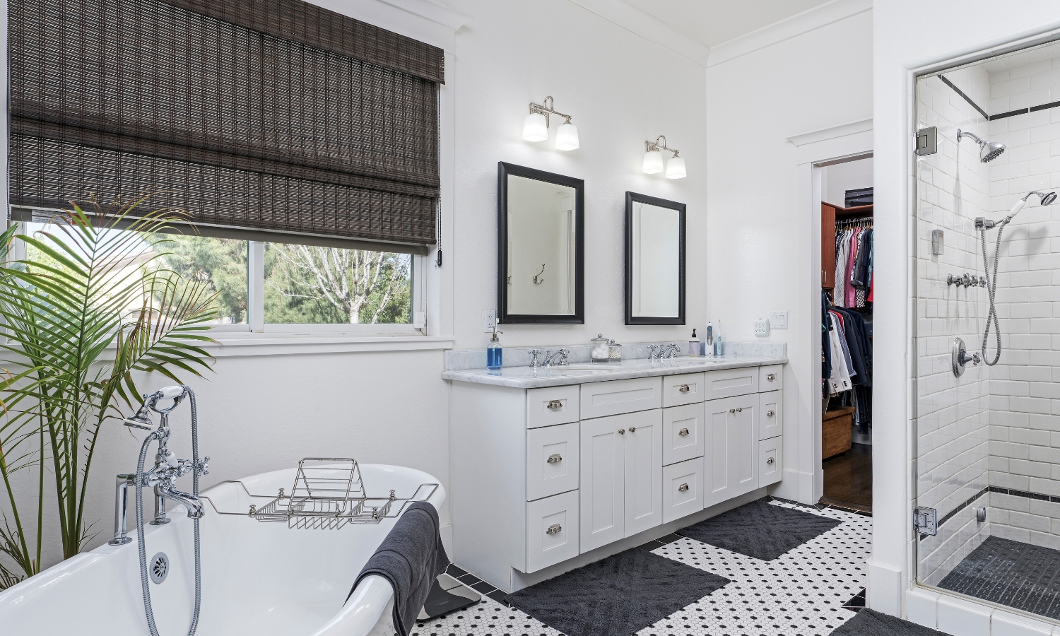 A bright, updated bathroom featuring a walk-in shower, double vanity, and freestanding tub — a perfect example of how to remodel your bathroom in New Orleans for comfort and resale value.