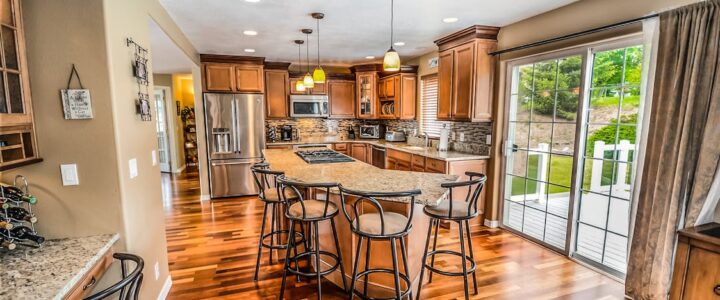 Are Discount Real Estate Agents Worth It? Weighing Savings Against Service Quality in Georgia Minimalist white scale evenly balancing a small model of a house on one side and a stack of coins on the other, symbolizin...