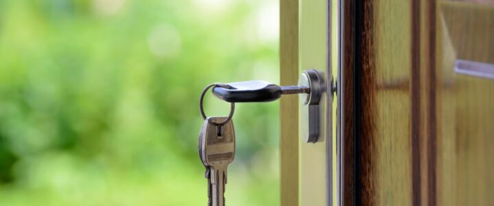 Saving on Realtor Fees in Columbus, IN: A Homeowner’s Guide to Modern Commission Models Minimalist photo of a clean, white piggy bank placed next to a set of house keys on a bright surface, symbolizing saving m...